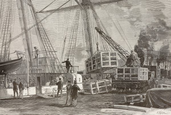 An 1885 engraving of large wooden crates being lifted by crane onto a sailing ship at a dock, with men in top hats watching